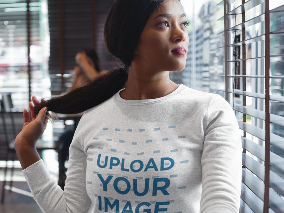 Placeit Woman Wearing a Crew Neck Sweatshirt Template While Looking