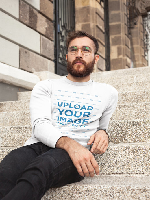 Placeit Man Wearing a Crew Neck Sweatshirt Template While Lying in