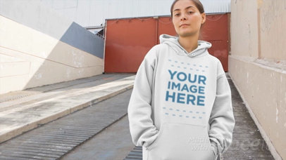 Placeit - Woman Wearing a Pullover Hoodie Video Standing on an ...