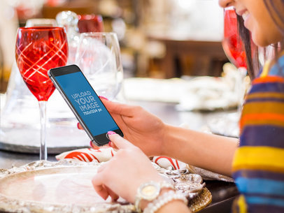 Placeit Portrait Mode iPhone 6 Mockup Girl Using iPhone 6 at Dinner