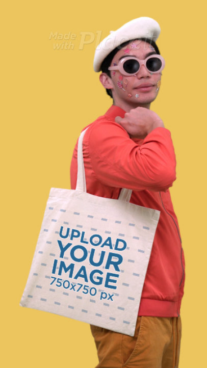 Placeit - Video of a Man with Face Stickers Carrying a Tote Bag