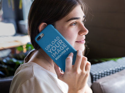 Mockup of a Woman Holding an iPhone Case Against Her Ear