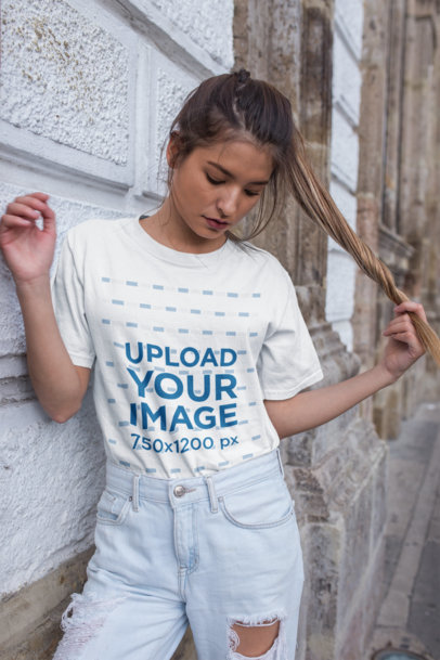 Unisex T-Shirt Mockup Featuring a Trendy Woman Wearing Distressed Jeans 22959