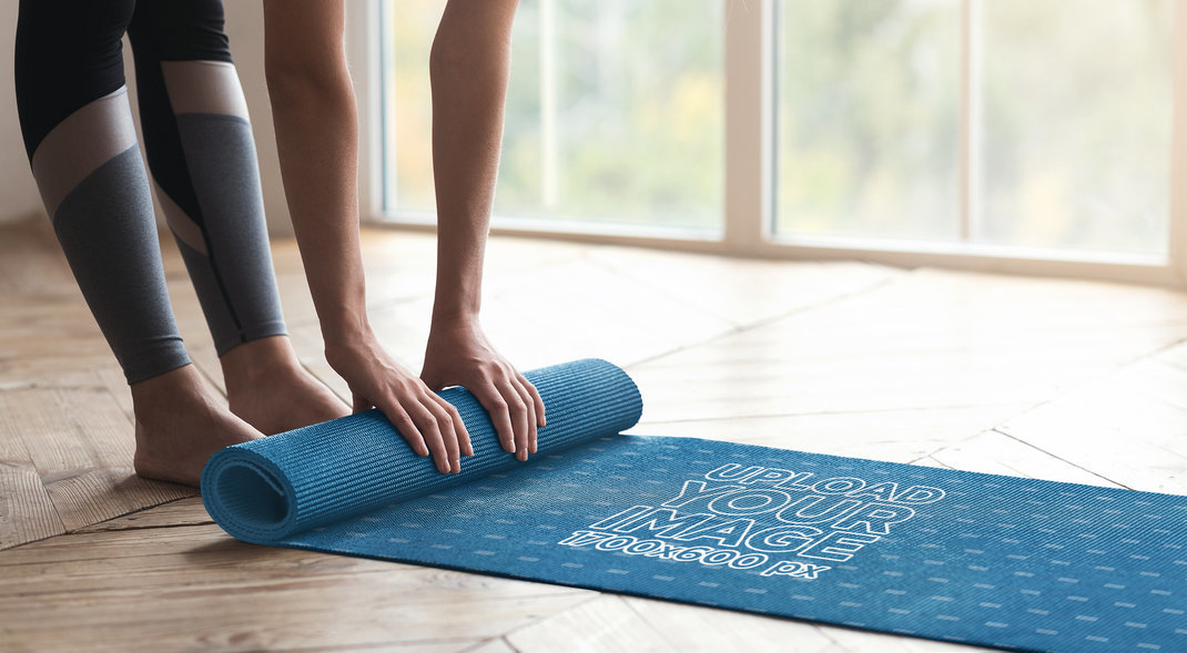 Placeit Mockup of a Woman Rolling Up a Yoga Mat