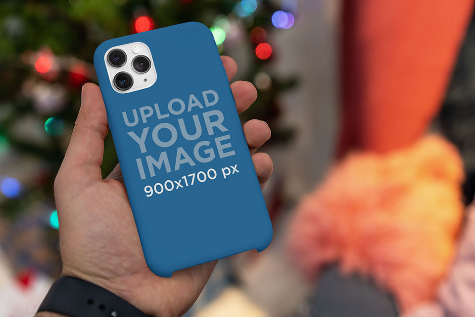 Placeit Phone Case Mockup Featuring Christmas Lights in the Background